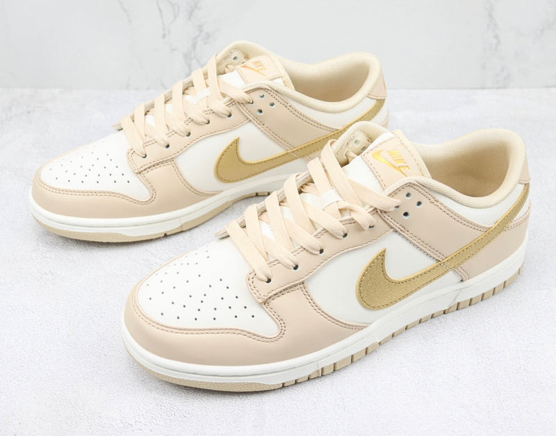 Tênis Nike Dunk Low ‘Metallic gold’