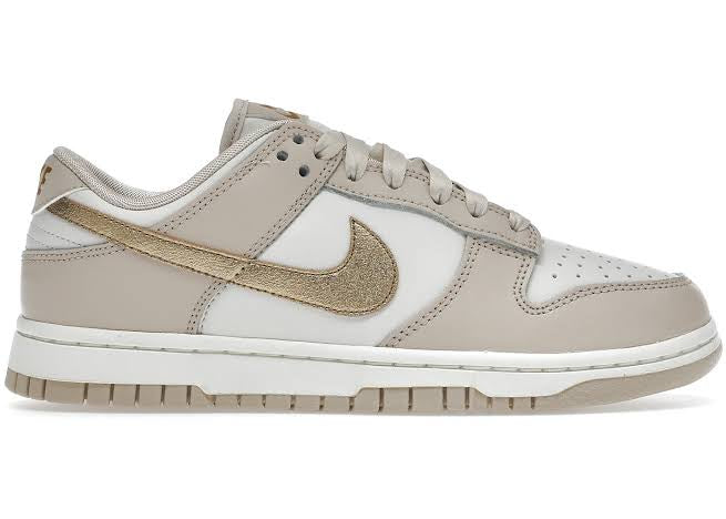 Tênis Nike Dunk Low ‘Metallic gold’