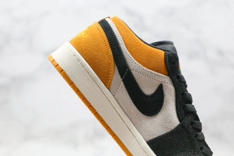 Tênis Nike Air Jordan 1 Low University Gold Black